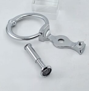 silver door knocker with door viewer